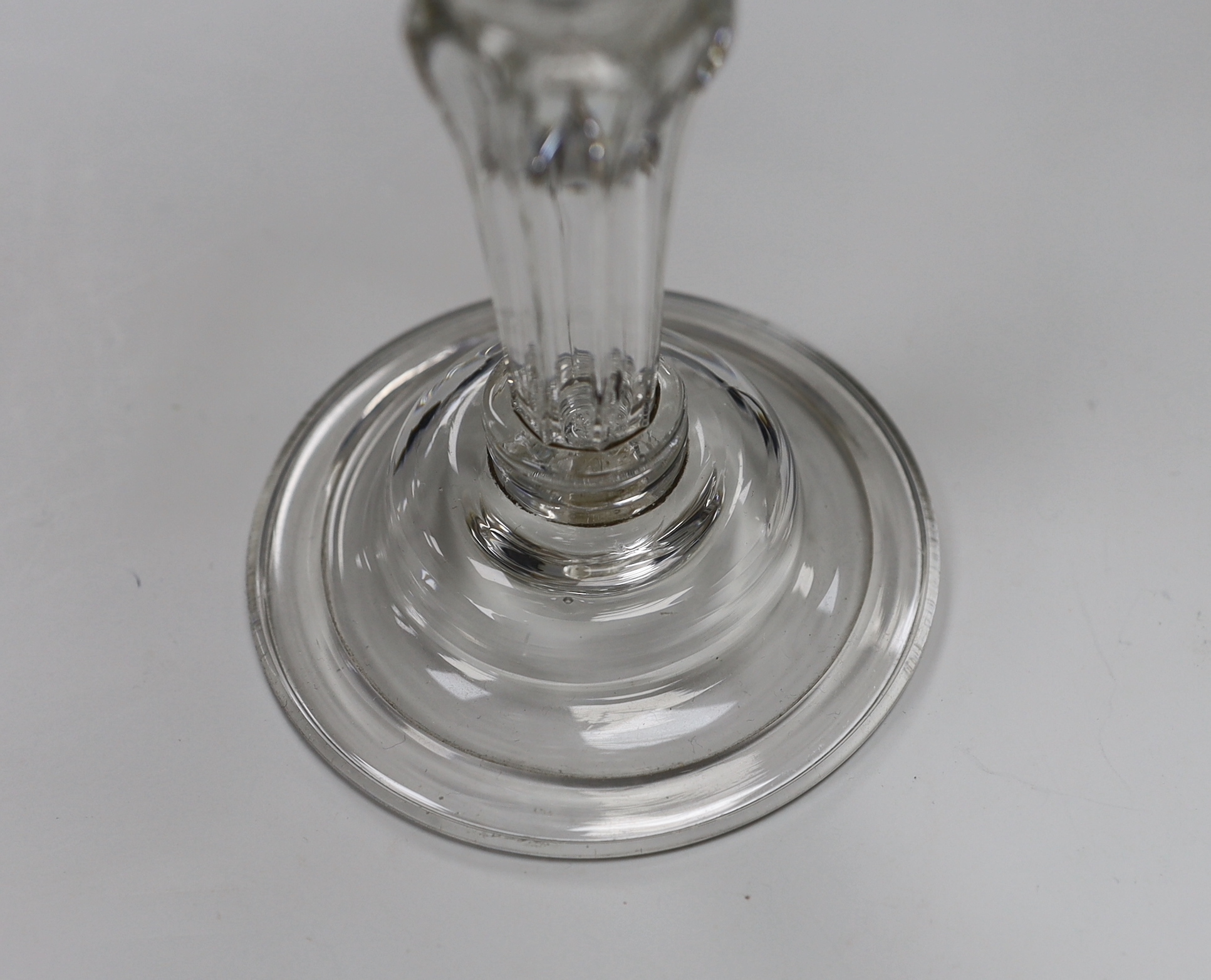 An English lead crystal champagne or sweetmeat glass, c.1745, flat double ogee bowl with everted rim, on double collar, eight sided Silesian stem on double collar, domed, folded foot, rough pontil, 15.6cm high